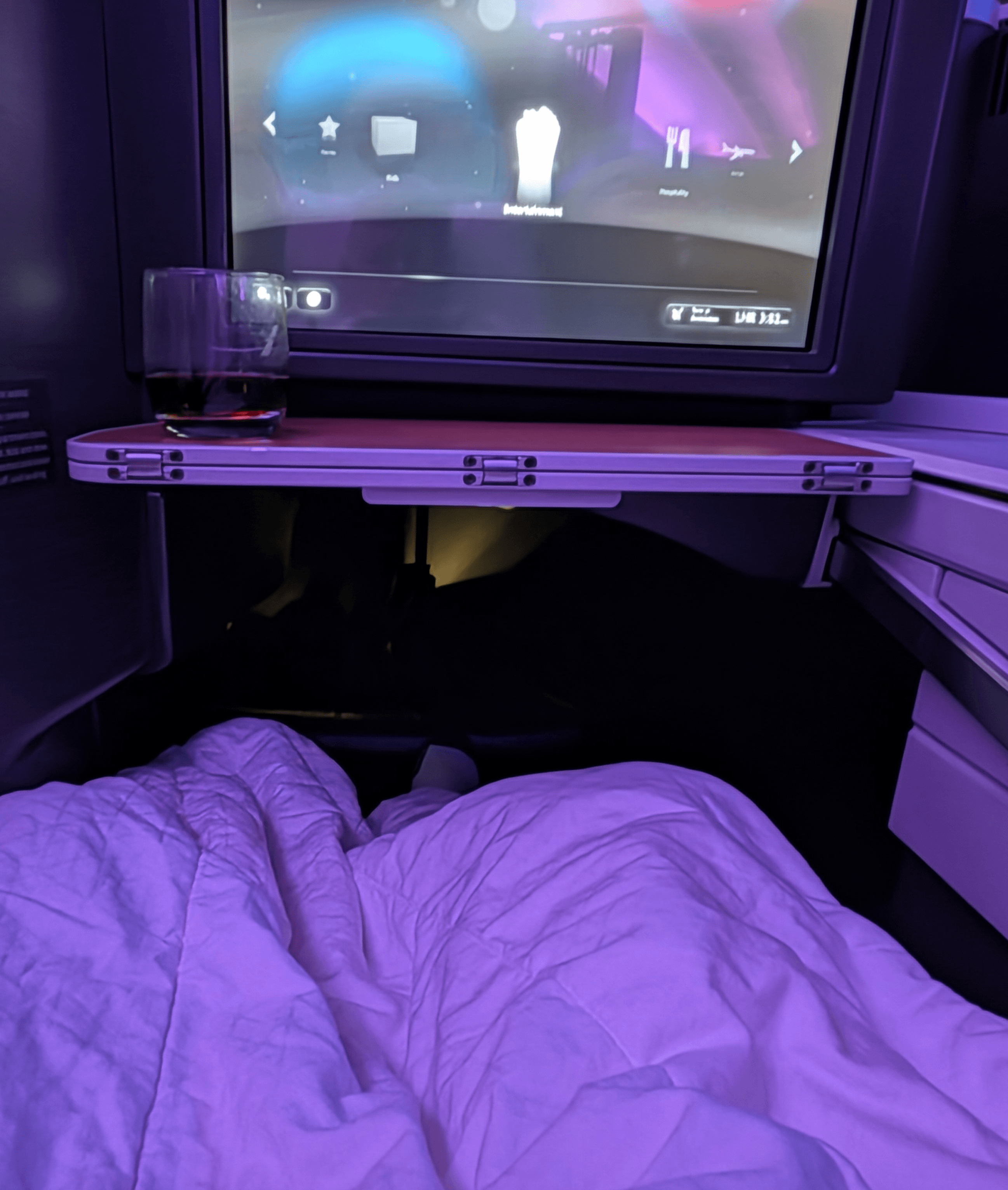 Business-class seat converted into a lie-flat bed